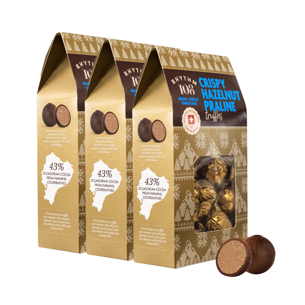 Three boxes of Rhythm Crispy Hazelnut Praline Truffles with a close-up of a box showing the truffles inside.